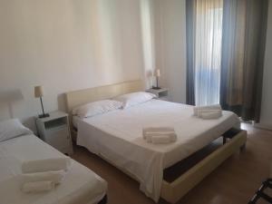 Postel nebo postele na pokoji v ubytování Reggio Centro B&B