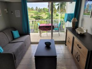 Posezení v ubytování Appartement vue sur le Golf Marina de Saint François