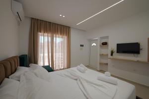 Ένα ή περισσότερα κρεβάτια σε δωμάτιο στο Villa Henrik 77 Saranda Centrum