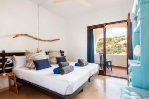 Ένα ή περισσότερα κρεβάτια σε δωμάτιο στο Apartment Menorca Torretes 26 by Mauter Villas