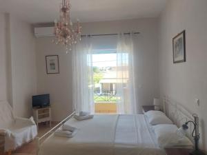 A bed or beds in a room at Foivos Seaside Apartments