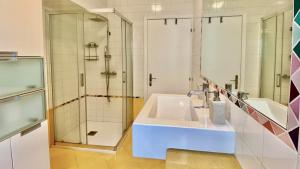 a bathroom with a sink and a shower at Venice Travel Dream Spacious Apartment near Venice in Mestre +20 photos