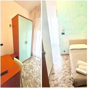 una camera con letto e comò con specchio di Hotel Vernel a Rimini
