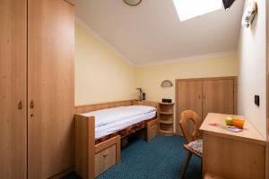 Postel nebo postele na pokoji v ubytování Berg Hotel Latemar Spitze