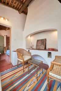 a living room with two chairs and a table at Casa Bica D'Alva in Vila Alva
