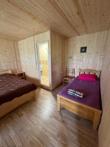 Ένα ή περισσότερα κρεβάτια σε δωμάτιο στο Guesthouse SANIKO