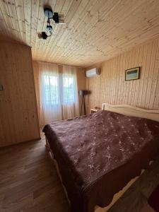Ένα ή περισσότερα κρεβάτια σε δωμάτιο στο Guesthouse SANIKO