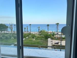a view of the ocean from a window at ERDEM HOTEL in Antalya