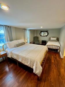 a large bedroom with a large bed and a mirror at Chester Inn in Chester