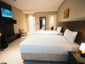 Zielo Hotel tesisinde bir odada yatak veya yataklar