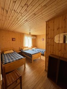 Ένα ή περισσότερα κρεβάτια σε δωμάτιο στο Guesthouse SANIKO