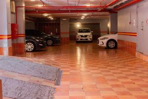 a garage with two cars parked in it at Best Trip Hotel in Jeddah
