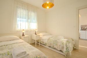 Posteľ alebo postele v izbe v ubytovaní Apartman Polje