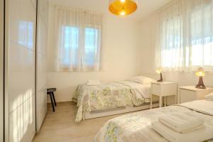 Posteľ alebo postele v izbe v ubytovaní Apartman Polje