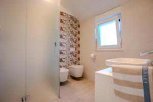 Kúpeľňa v ubytovaní Apartman Polje
