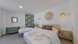 Postel nebo postele na pokoji v ubytování El Puerto de Fuengirola