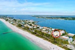 an aerial view of a resort on a beach at Island Hideaway steps to beach dock Bridge St in Bradenton Beach