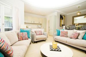 a living room with two couches and a table at Casa Federico in Puerto del Carmen