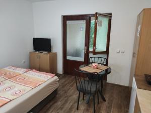 a small room with a small table and a bed at Studio Elizabeta in Soko Banja