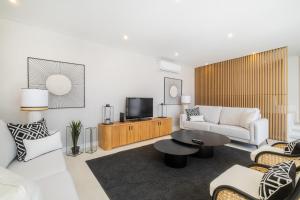 a living room with a couch and a tv at Valbom Luxury Village in Galé +68 photos