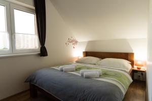 Posteľ alebo postele v izbe v ubytovaní Apartmány Kohoutek a Slepička v Novohradských horách
