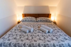 Posteľ alebo postele v izbe v ubytovaní Apartmány Kohoutek a Slepička v Novohradských horách