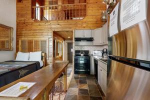 a small kitchen in a tiny house with a bed at Kings Run Relaxation in Kings Beach