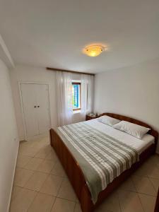 Postel nebo postele na pokoji v ubytování Sunset House Apartments & Rooms