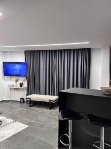 a living room with a couch and a table at Lumi Residence Apartment 2 in Sarandë