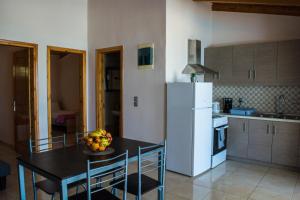 Kuchyň nebo kuchyňský kout v ubytování Fanis seafront apartments