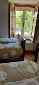 Postel nebo postele na pokoji v ubytování Casa Ines