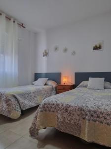 Posteľ alebo postele v izbe v ubytovaní Apartamento Cayetano + 12 fotografií