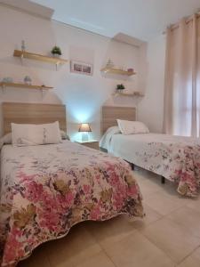 Posteľ alebo postele v izbe v ubytovaní Apartamento Cayetano
