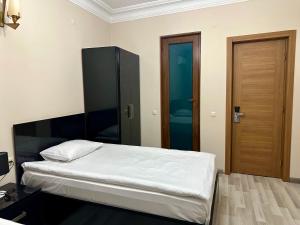 Voodi või voodid majutusasutuse Hotel Tsereteli toas