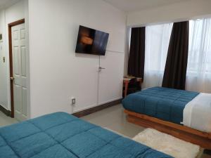 Voodi või voodid majutusasutuse Hotel Ming Shen toas