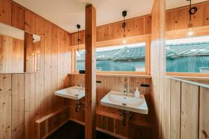 a bathroom with two sinks and a window at Ikeda Ryokan - Vacation STAY 79298v in Nishinoomote