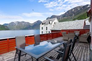 a balcony with a view of a lake and mountains at Aurland Guesthouse in Aurland