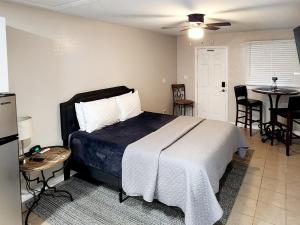 a bedroom with a bed and a table and chairs at Cozy Studio! in Lakeland