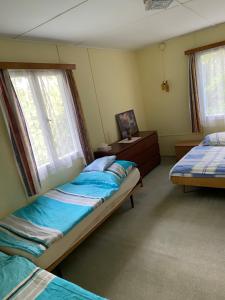 Postel nebo postele na pokoji v ubytování Chata Slapy Skalice 2