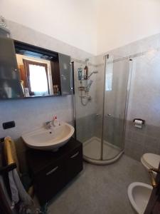 a bathroom with a sink and a shower at Villetta Tora in Santo Stefano di Magra +42 photos
