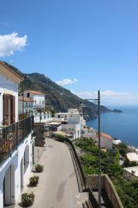 a view of a town with the ocean at Domus Alba in Praiano +25 photos