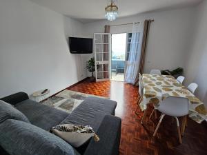 a living room with a couch and a table at Casa a Torre in Santa Cruz
