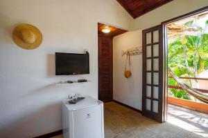 Μια τηλεόραση ή/και κέντρο ψυχαγωγίας στο Pousada Casa Cactus Praia da Tartaruga Búzios