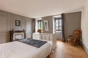 Postel nebo postele na pokoji v ubytování La Maison des Carmes - Patio couvert - Hypercentre