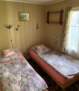 Ένα ή περισσότερα κρεβάτια σε δωμάτιο στο Chata Slapy Skalice