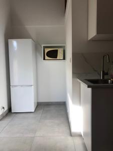 Η κουζίνα ή μικρή κουζίνα στο L’escapade marine ensoleillée