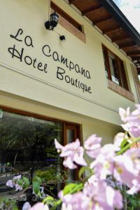 a building with a sign for a campo hotel boutique at La Campana Hotel Boutique in Medellín