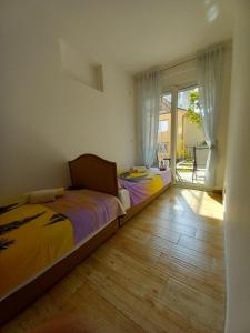 Postel nebo postele na pokoji v ubytování Apartman Gačić