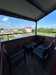 a view from the balcony of a restaurant with chairs and tables at Mirabilis Apartments in Međugorje