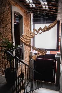a group of wooden umbrellas hanging from a building at Cas'Amazonia Brasil in Belém
